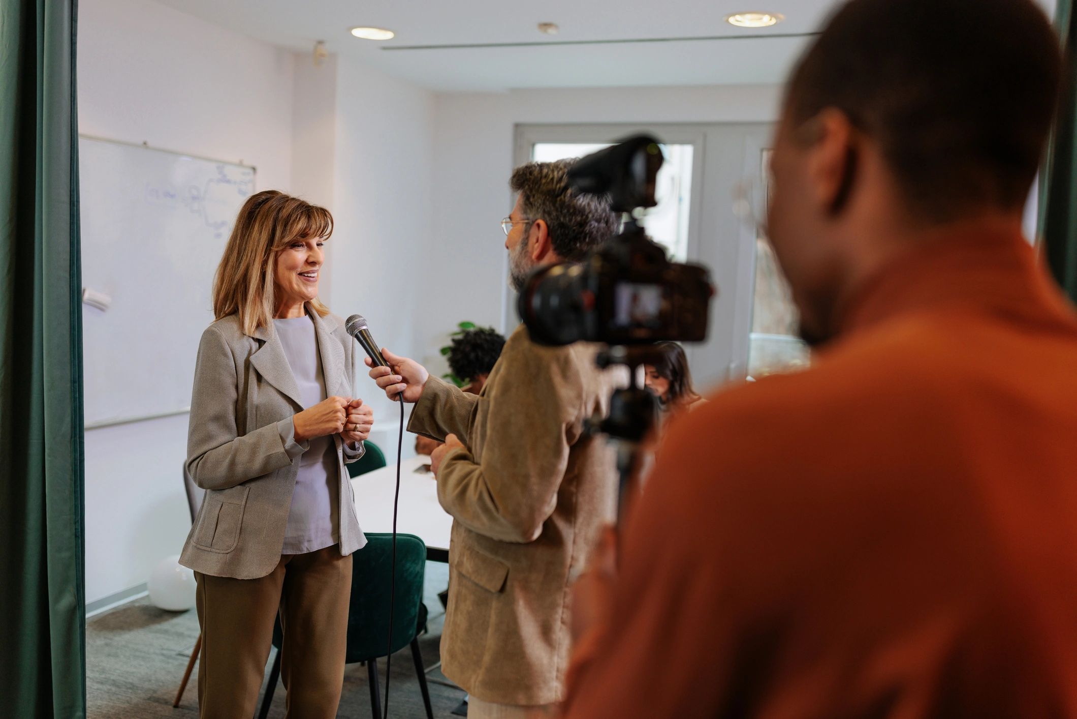 Production crew filming an interview
